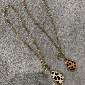 Gold tone cheetah necklaces